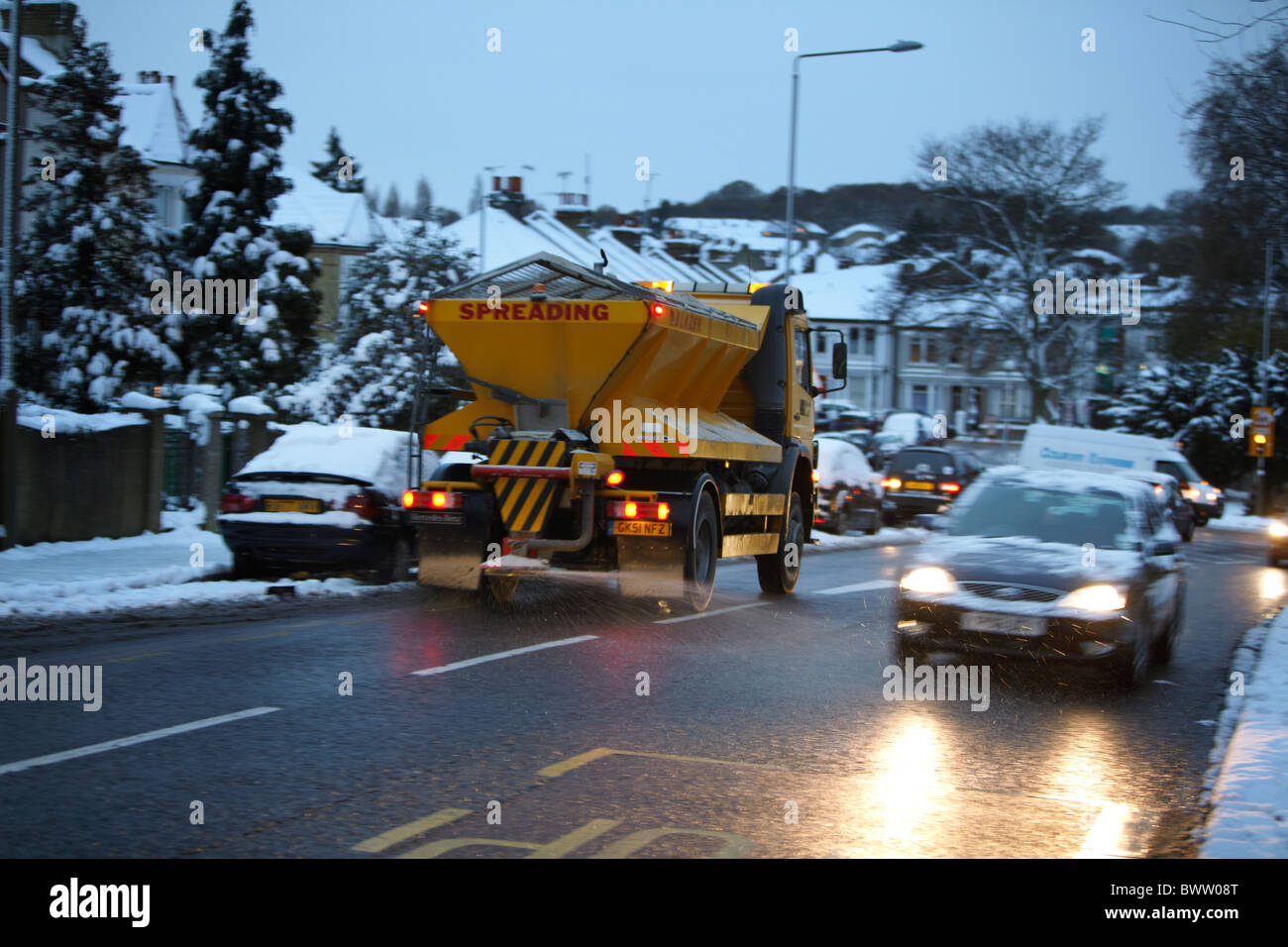 Gritter on snowy uk London road Stock Photo