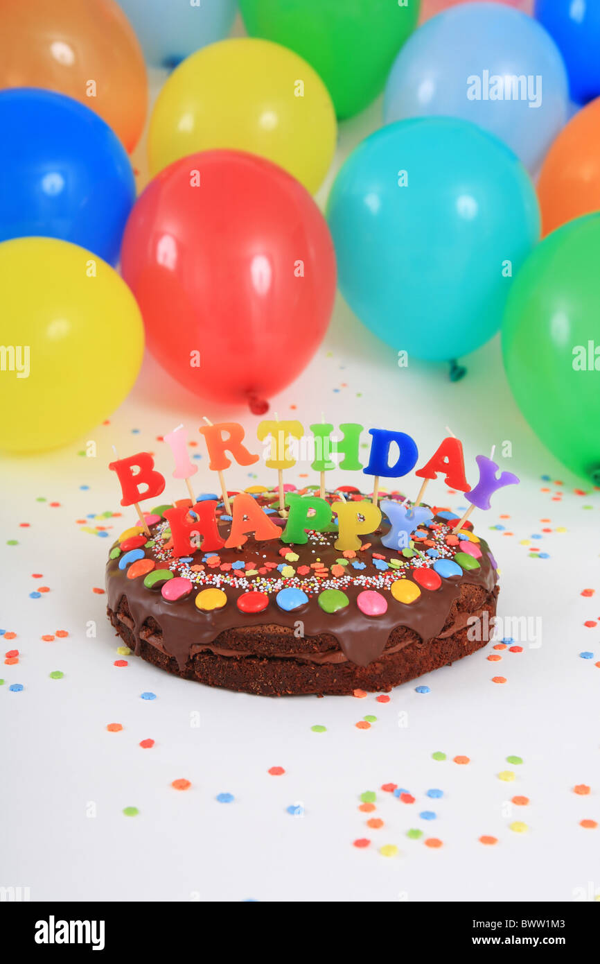 Birthday cakes Happy Birthday cake candles balloons party decoration adornment studio celebration colorful c Stock Photo