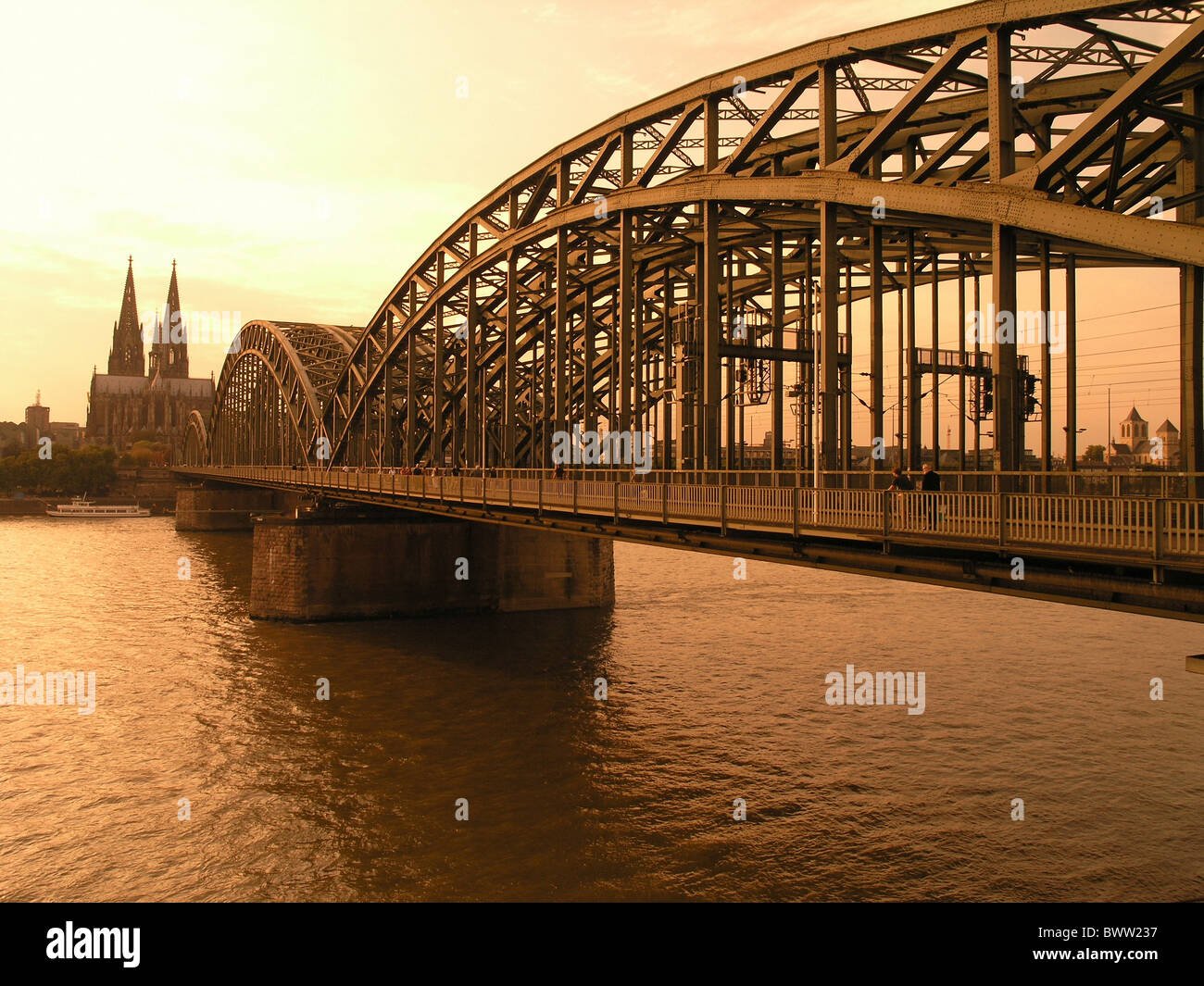 Germany Europe Cologne city Hohenzollern bridge iron bridge construction Rhine river cathedrale towers church Stock Photo