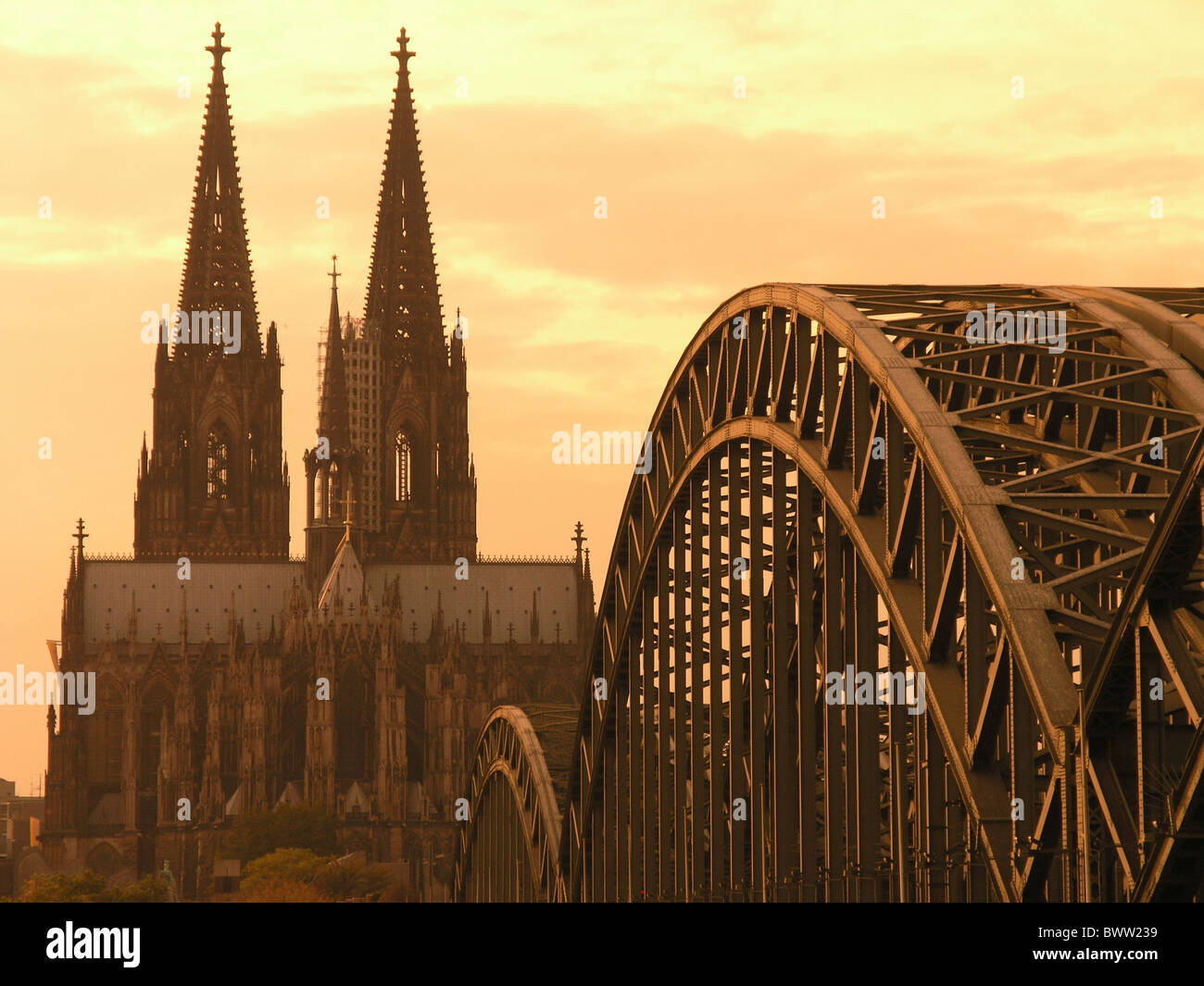 Germany Europe Cologne city Hohenzollern bridge iron bridge construction Rhine river cathedrale towers church Stock Photo