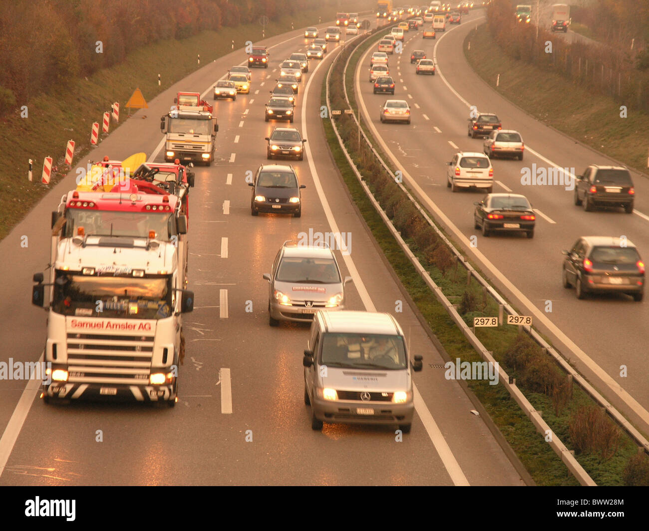 Switzerland Europe traffic jam cars trucks dusk dawn evening overview overlook freeway motorway street ro Stock Photo