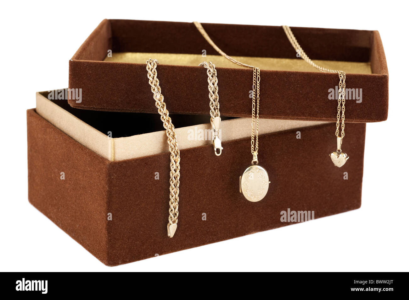 Gold jewelery draped over a 'brown suede' covered oblong box with open lid Stock Photo