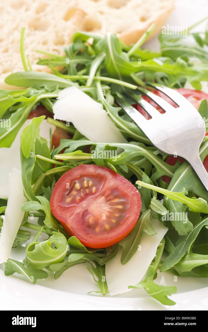 Rocket salad with tomato and pecorino Stock Photo
