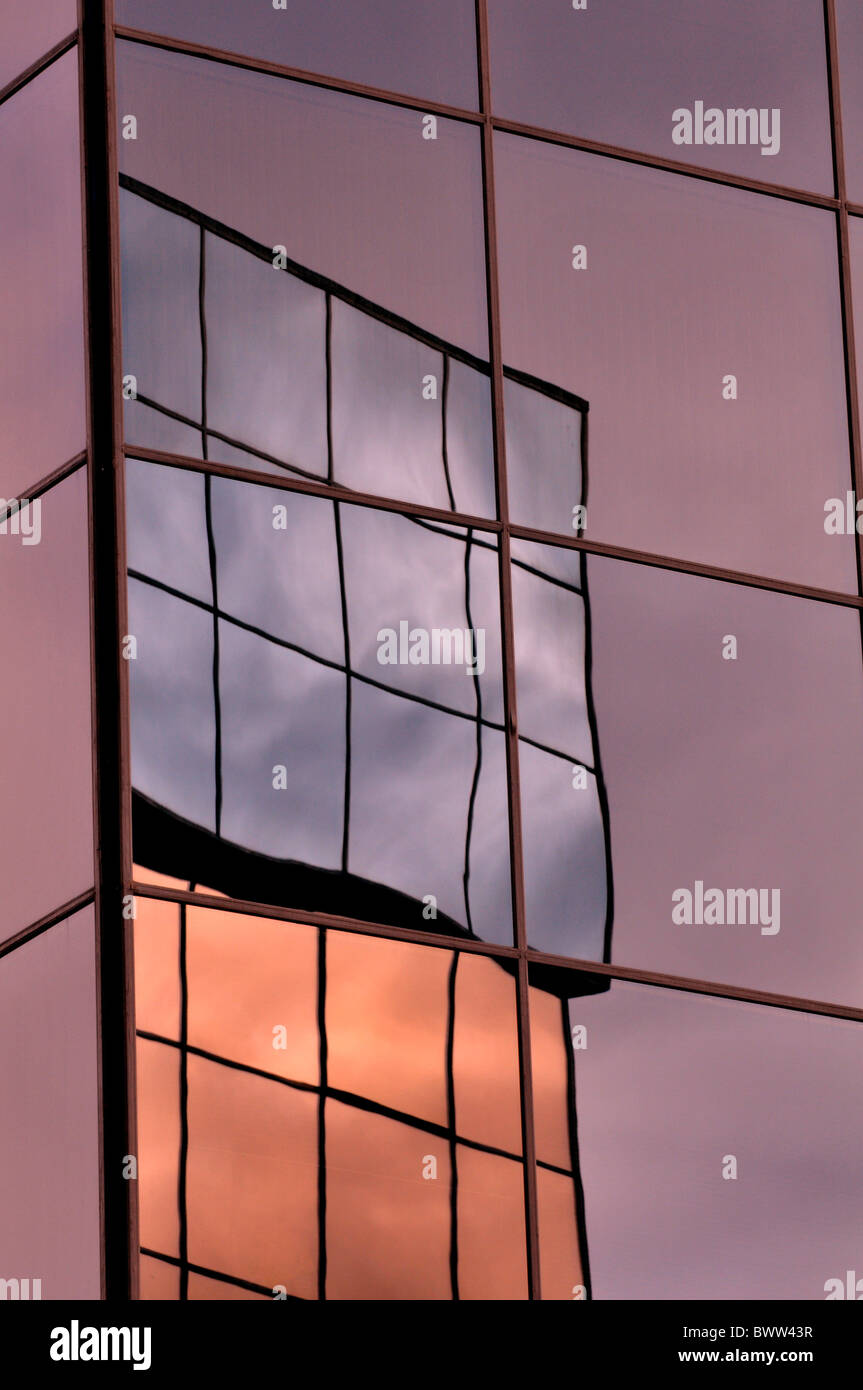 Reflection of buildings in mirrored glass Stock Photo