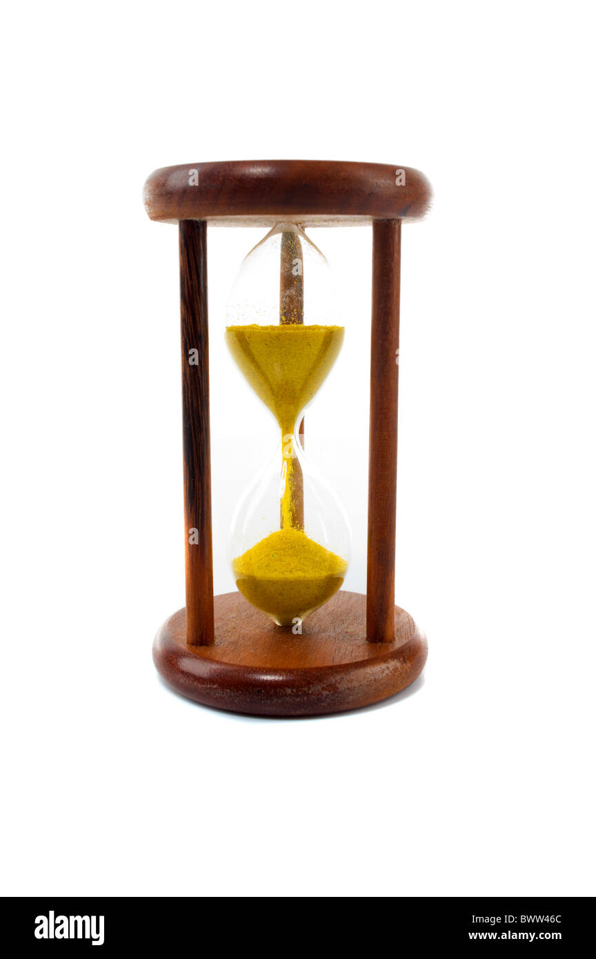 Vintage hourglass with yellow sand . Stock Photo