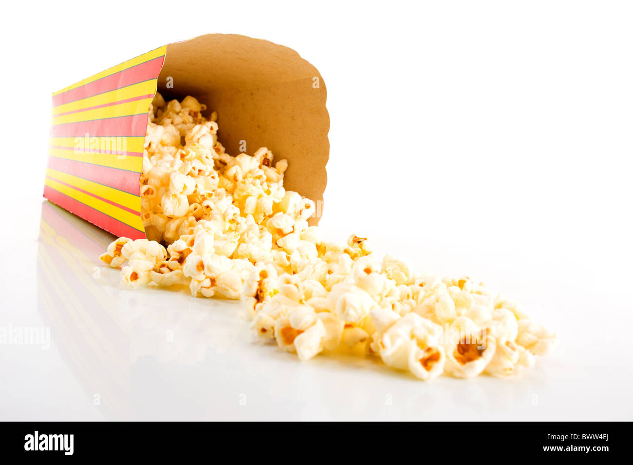 Snack box with popcorn dropped . Stock Photo