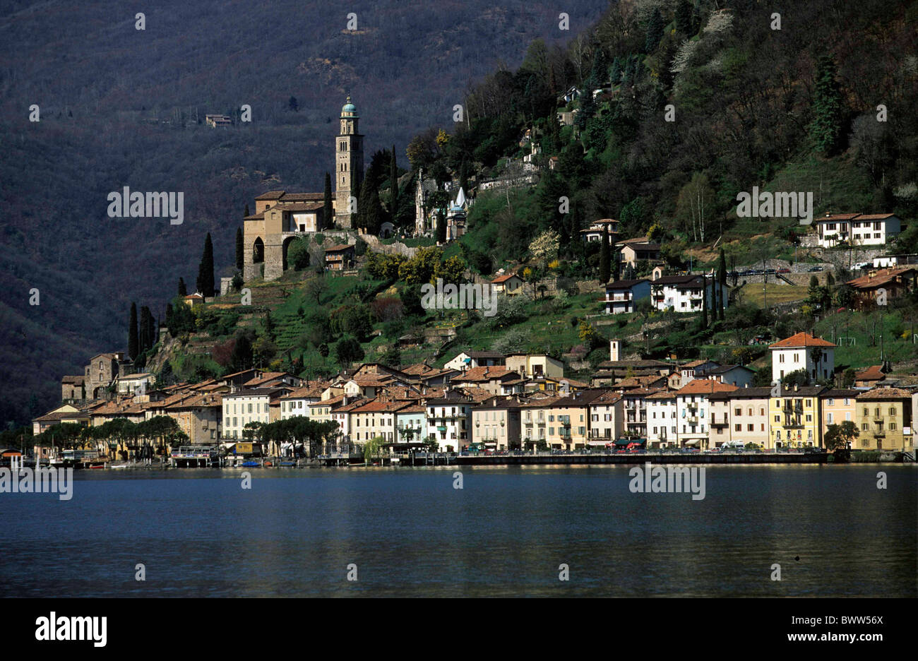 Switzerland Europe Morcote Canton Ticino Lake Lugano church houses homes  lake water mountains mountain sma Stock Photo - Alamy