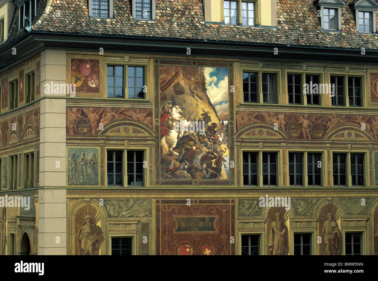 Switzerland Europe Canton Schwyz town Schwyz city hall painted facade windows old architecture paintaings h Stock Photo