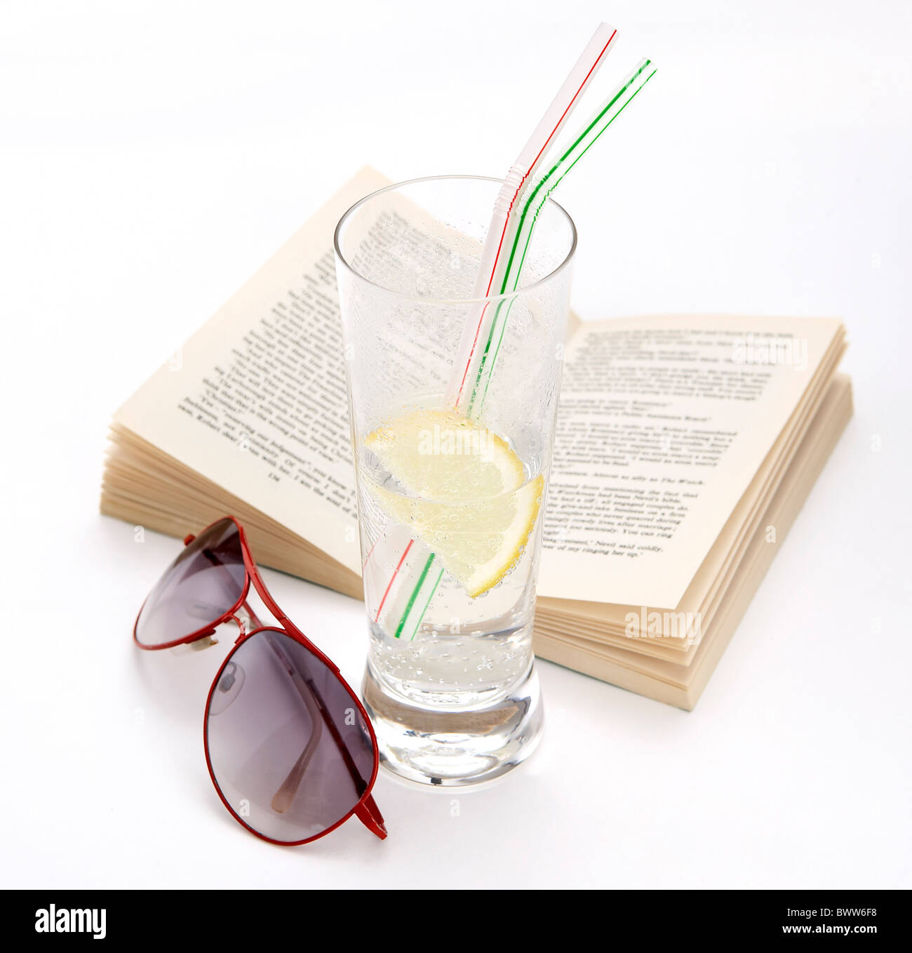still life on white background book sunglasses and drink Stock Photo