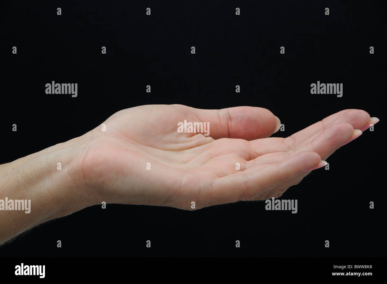 Hand older elder woman fingers open accept openly beg begging symbol concept Stock Photo