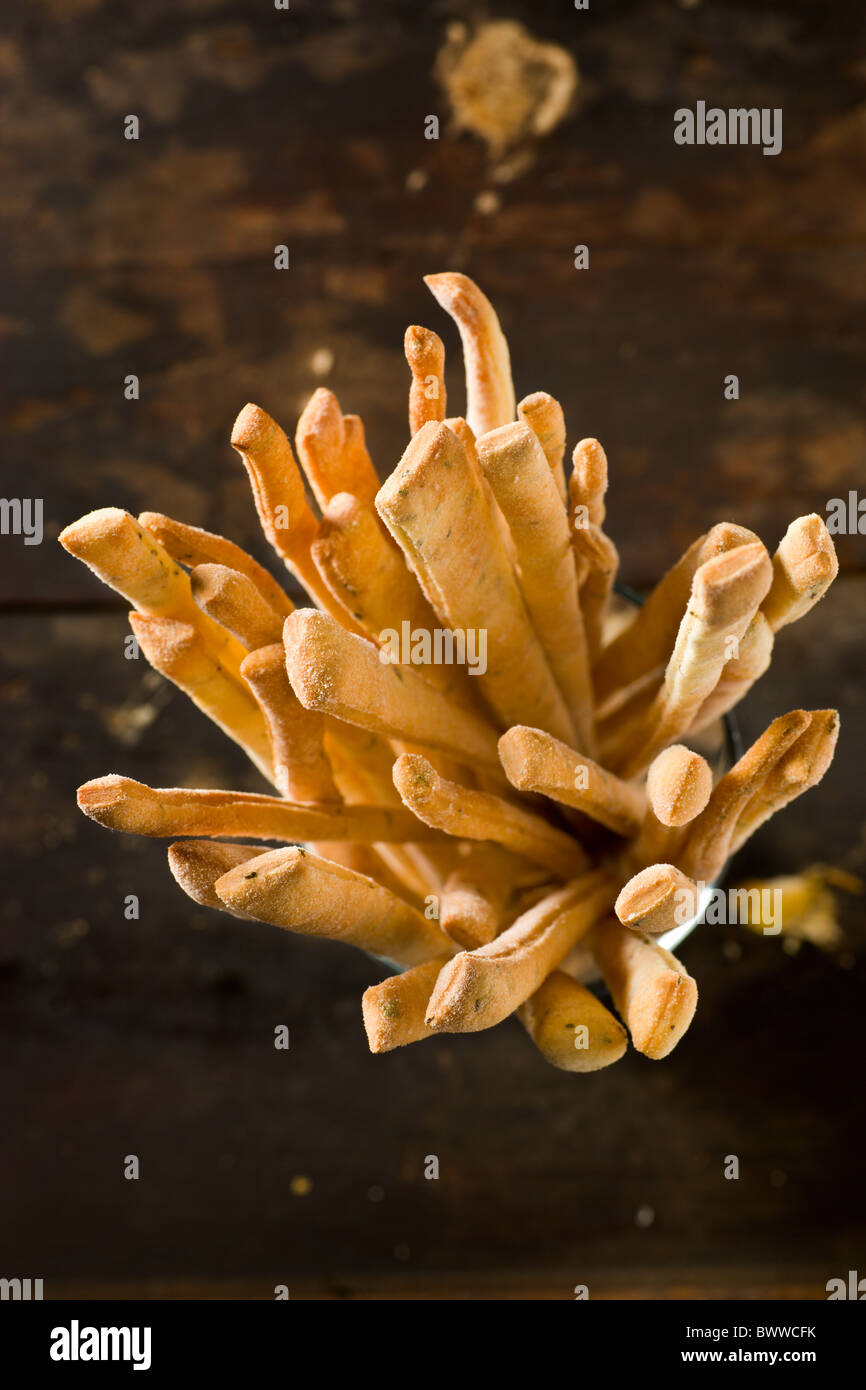 Artisanal Breadsticks on a rustic wood surface Stock Photo