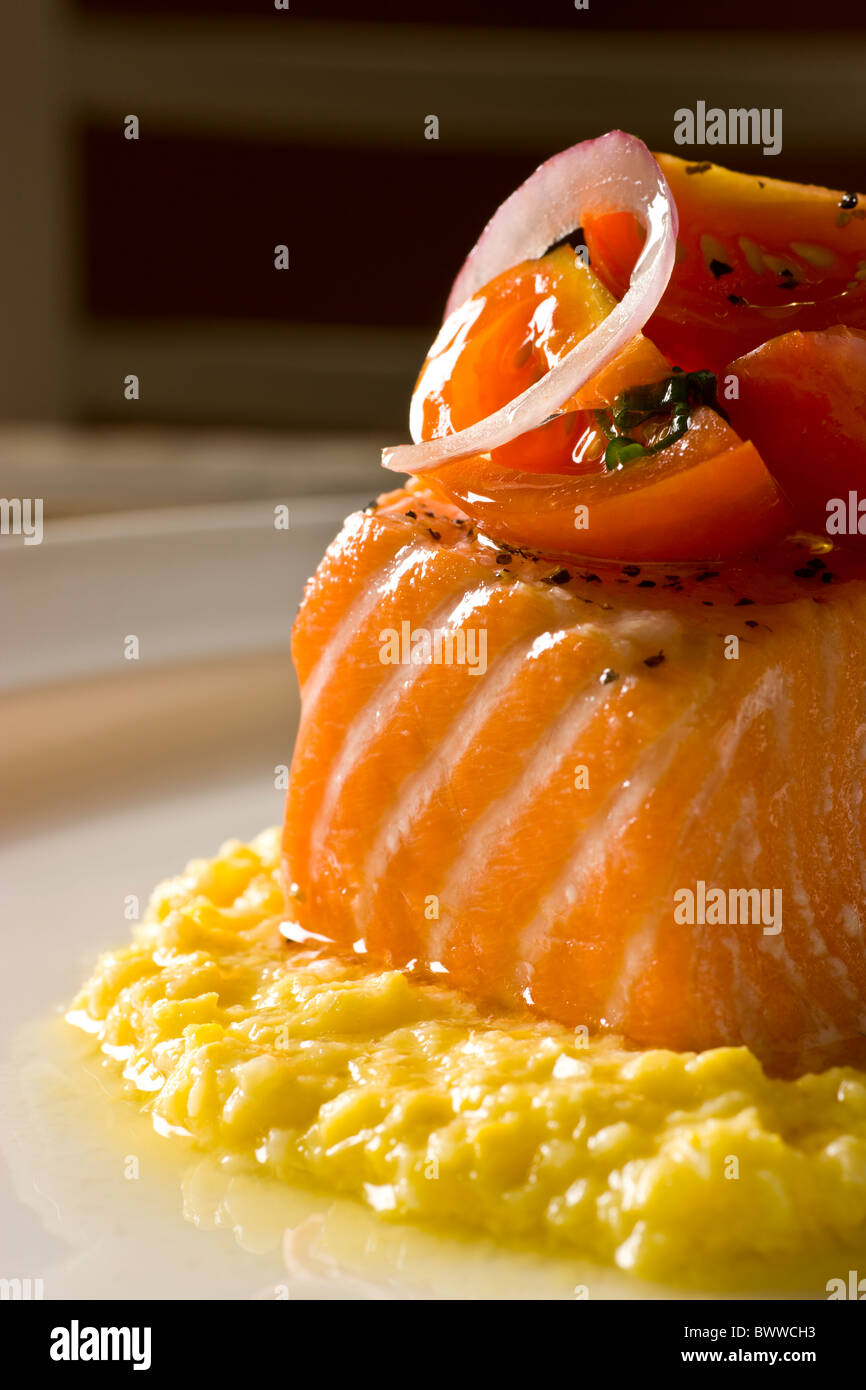 Slow Roasted Organic Salmon with Summer Corn Pudding and Tomato Vinaigrette. Stock Photo