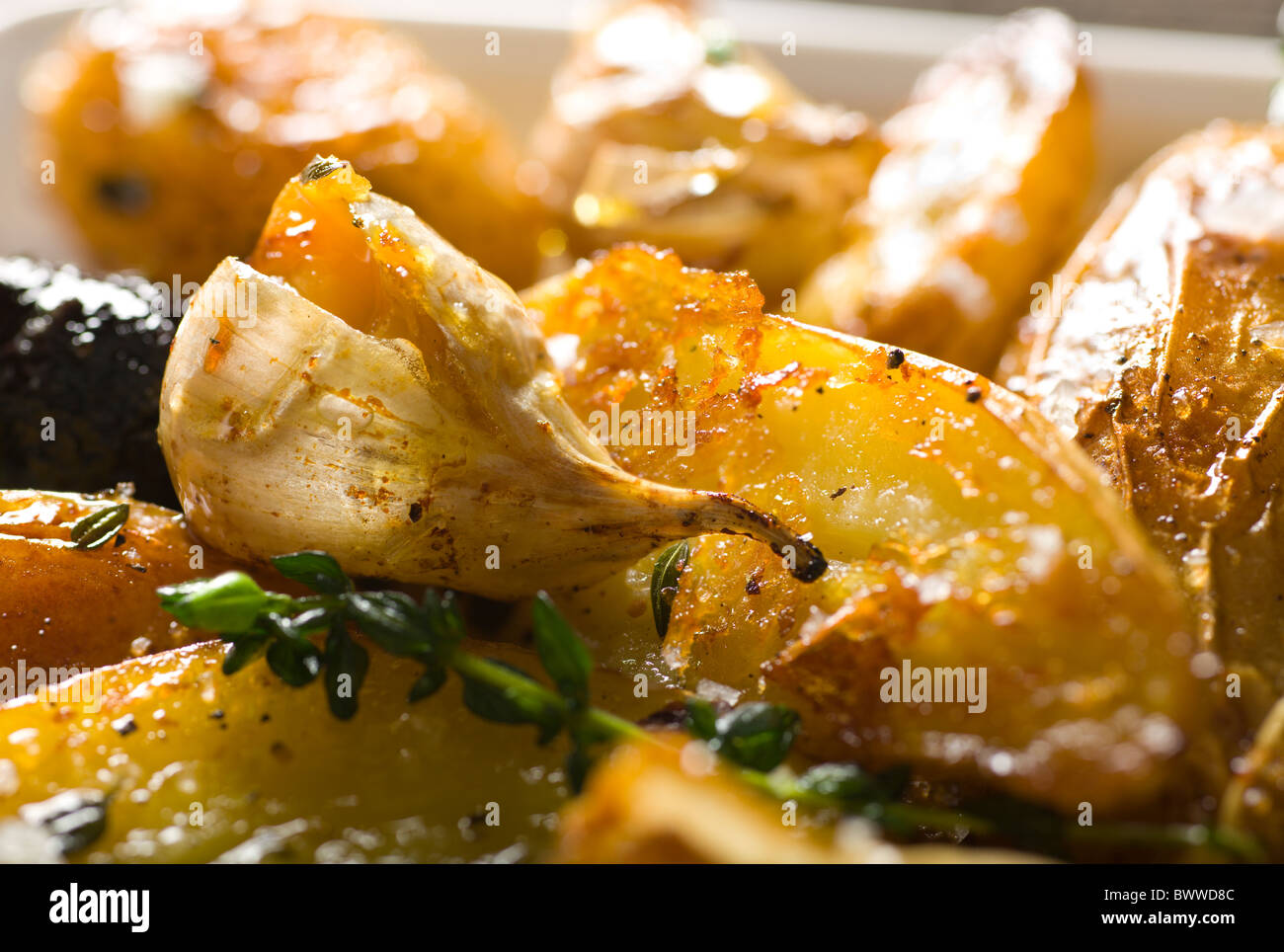 Roasted Fingerling Potatoes with Dried Figs, Garlic Cloves and Thyme. Stock Photo