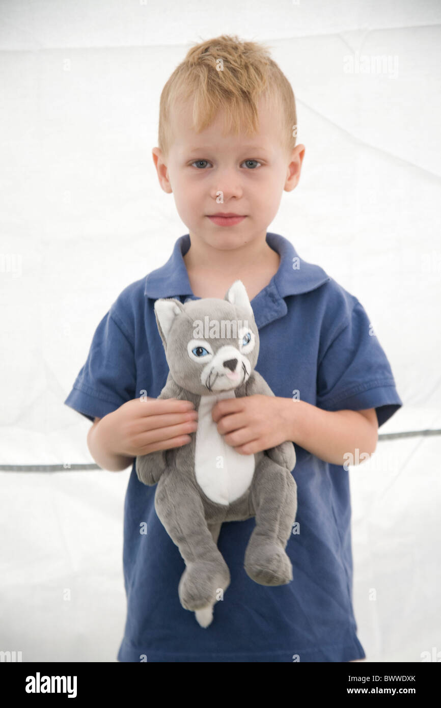 Portrait of boy holding stuffed toy animal Stock Photo