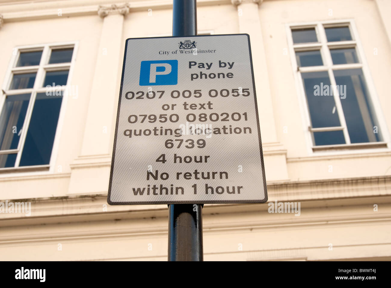 pay and display parking sign with telephone number Stock Photo