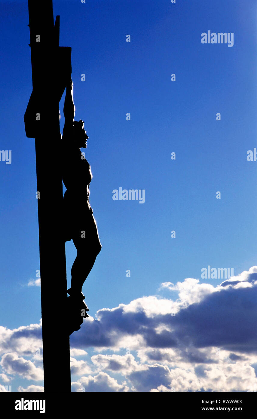 Statue of Jesus Christ on the cross against a cloudy sky Stock Photo ...