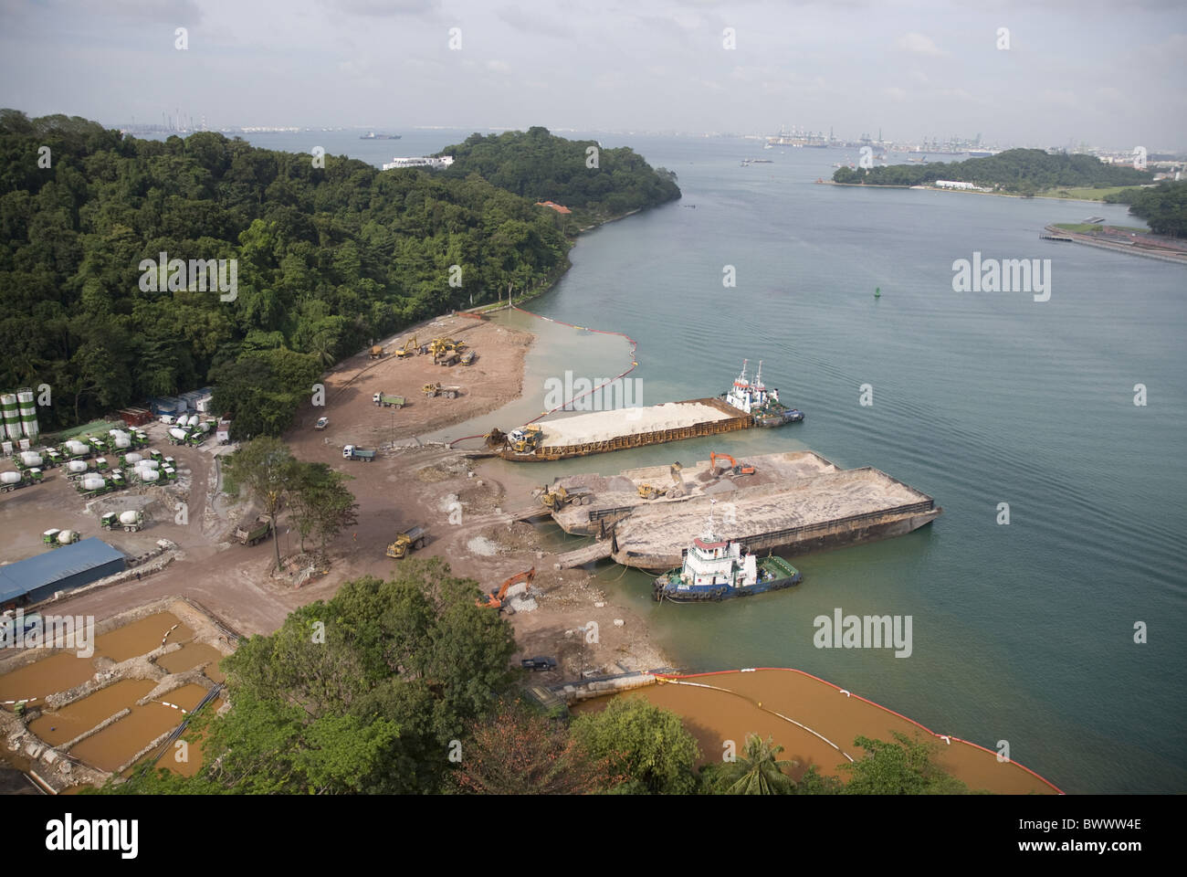 View coastal land reclamation barges Sentosa Stock Photo