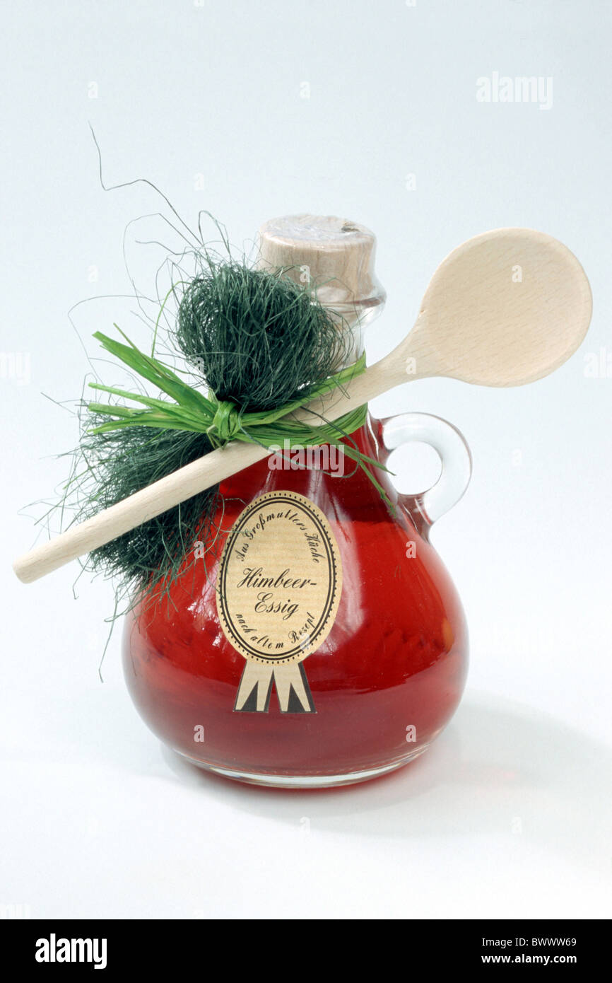 Raspberry flavored vinegar, studio picture. Stock Photo