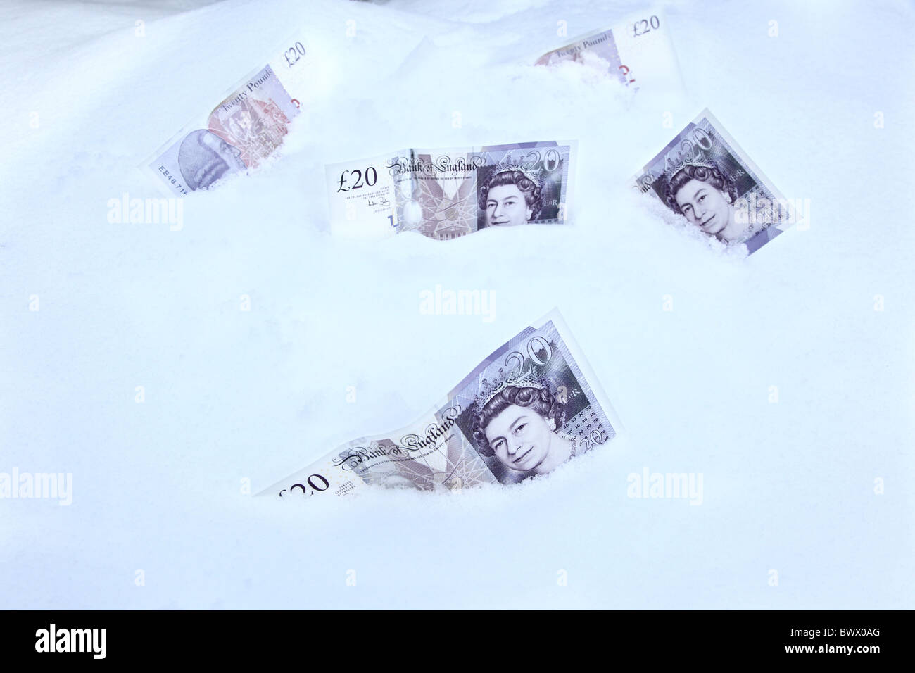 £100s worth of £20 notes lying on the snow Stock Photo