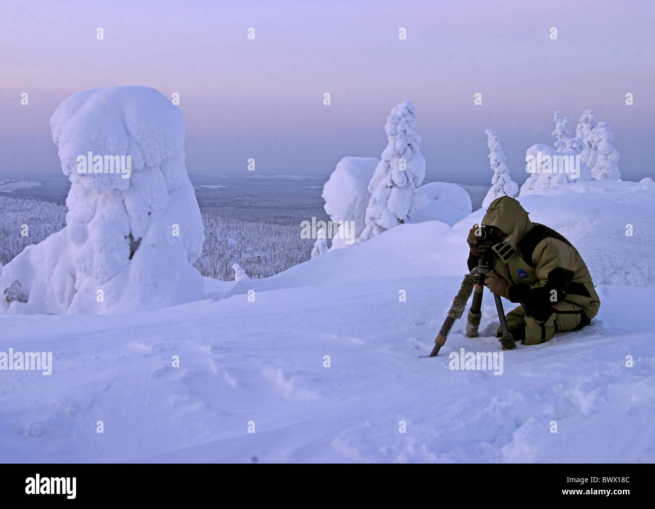 Landscape photographer photographing snow covered Stock Photo - Alamy