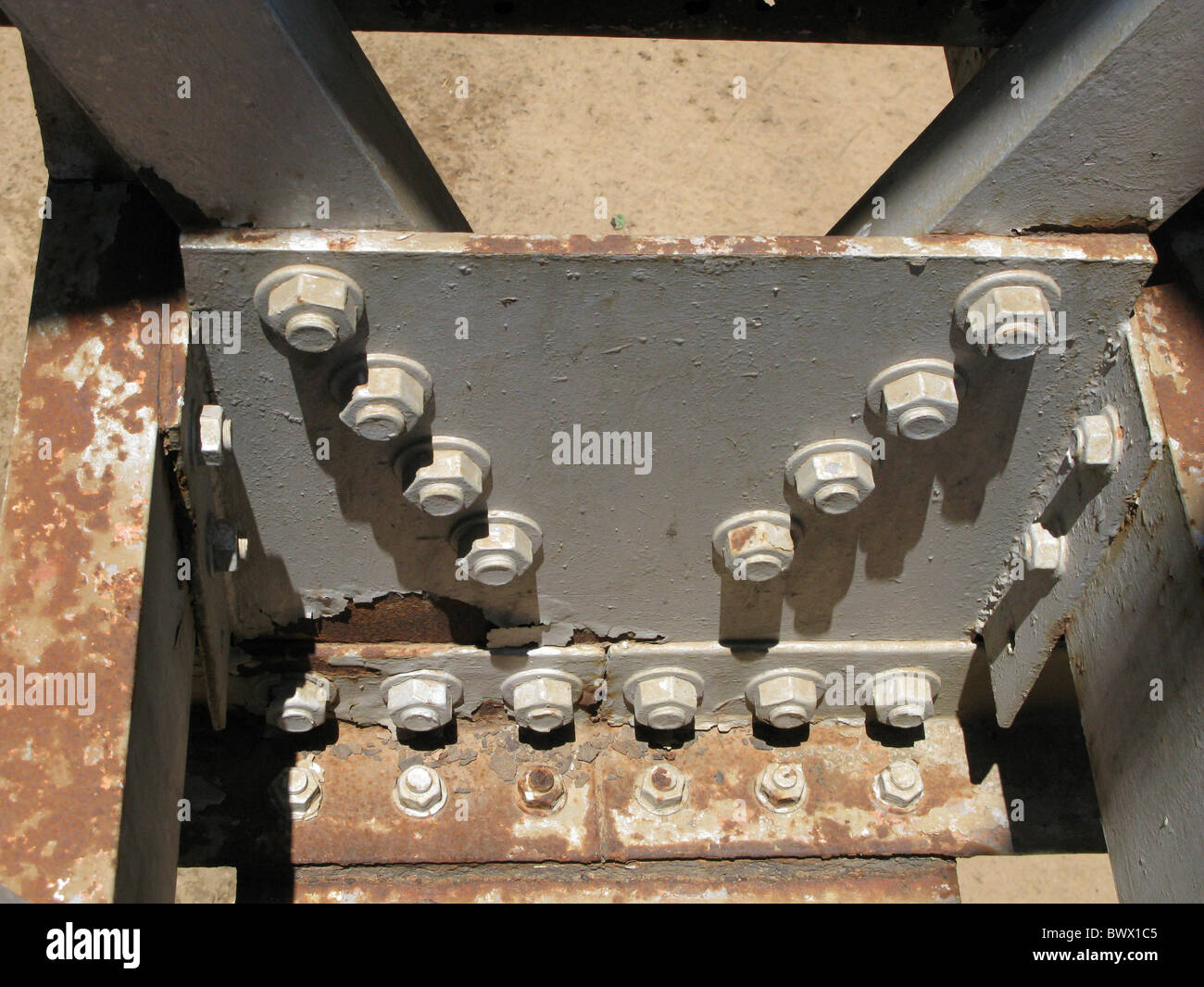 Close-up flaking paint rusty metal bridge River Stock Photo