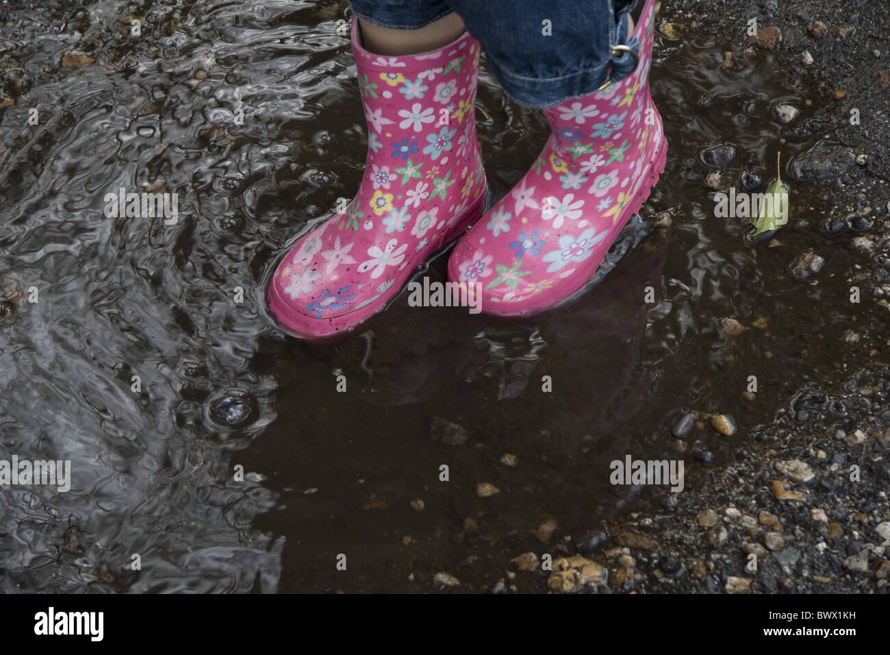 Child wearing boots hi-res stock photography and images - Alamy