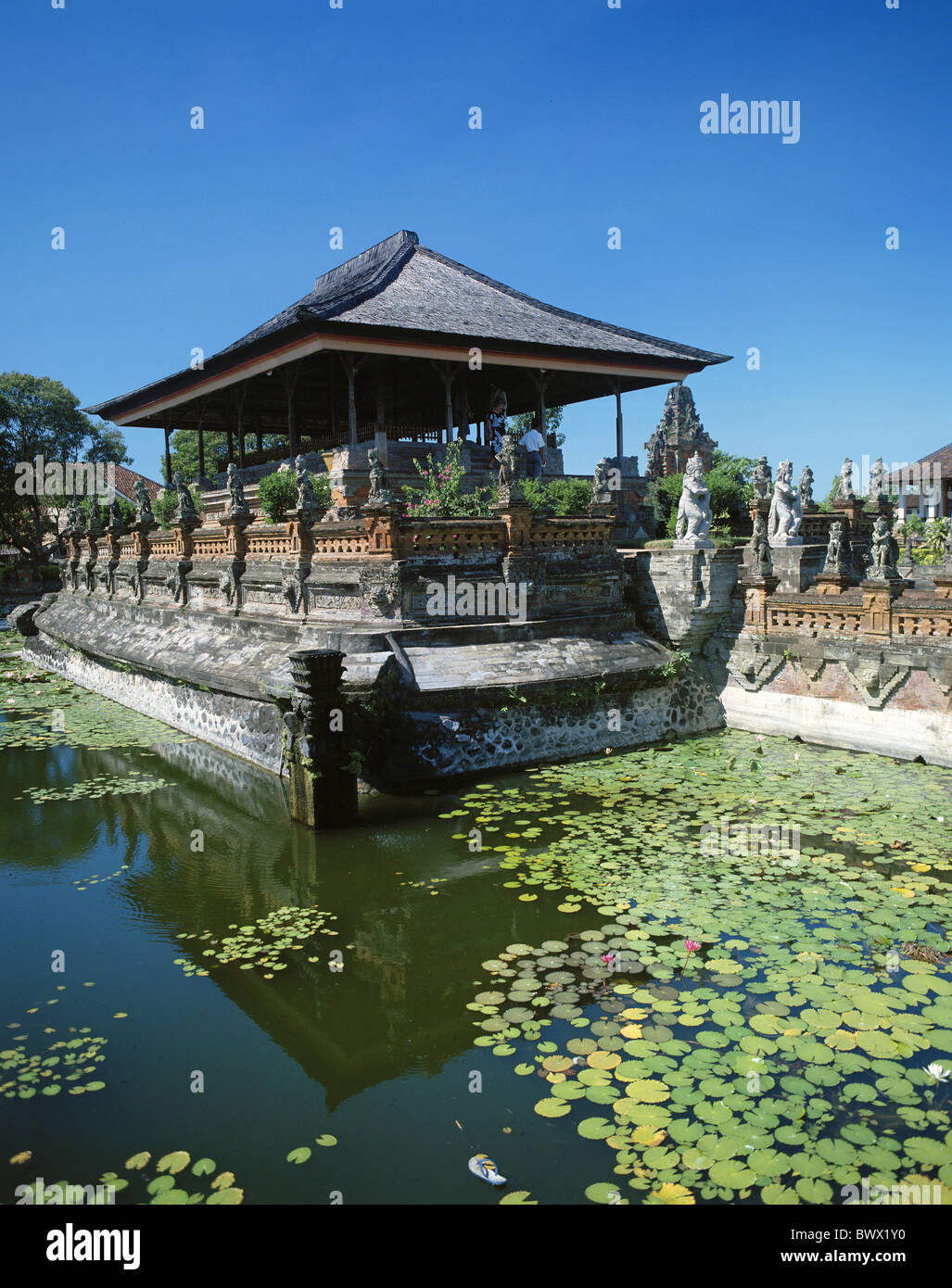 Bali Asia Klungkung water lilies sculptures Taman Gili pond temple temple arrangement Stock Photo