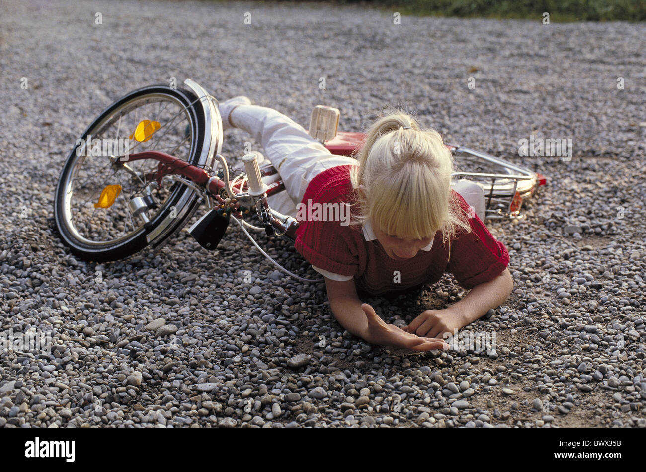 accident casualty traffic child bicycle bike overthrown hands injured
