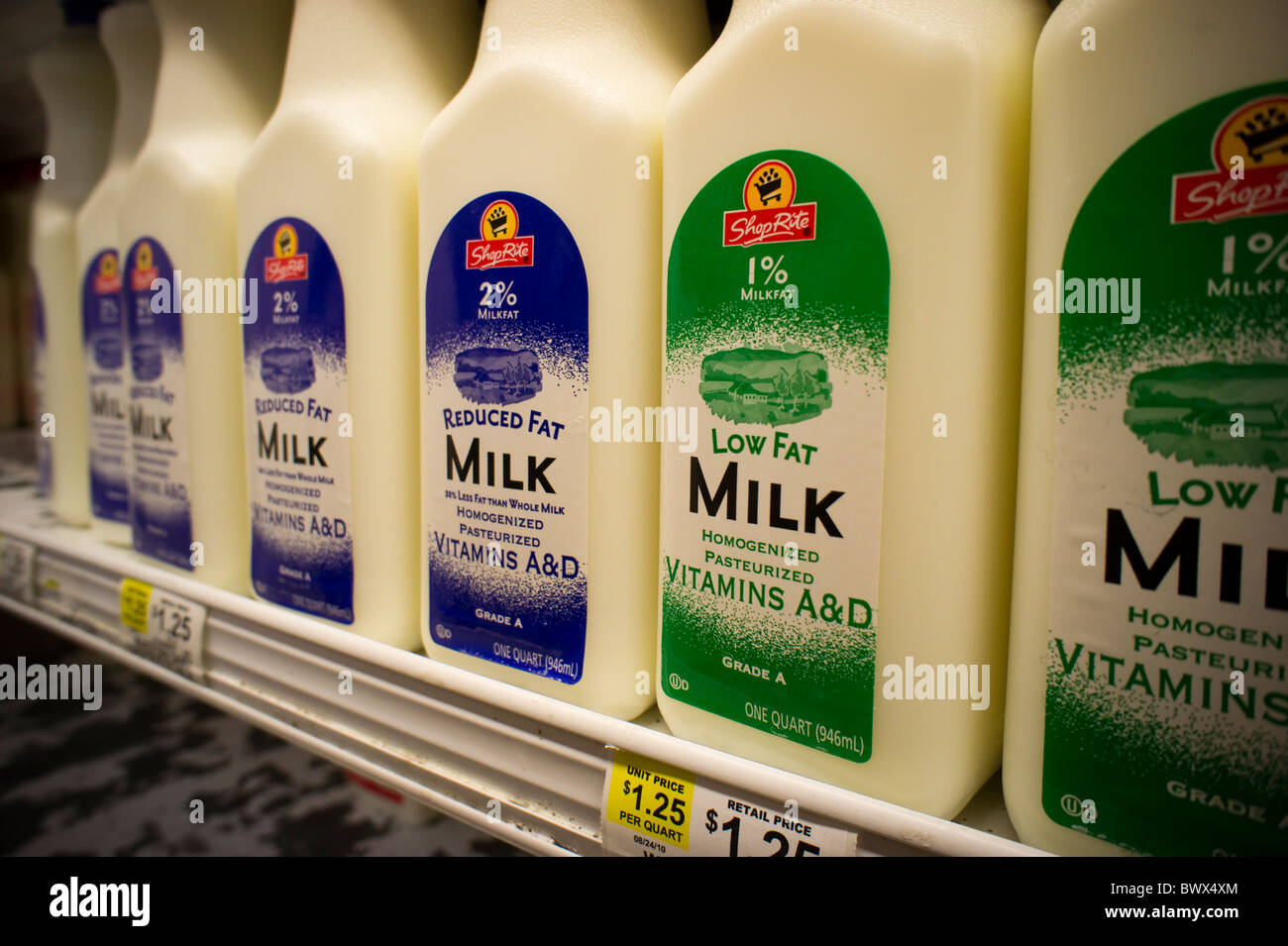Containers of vitamin A & D fortified milk in a supermarket refrigerator in New York Stock Photo