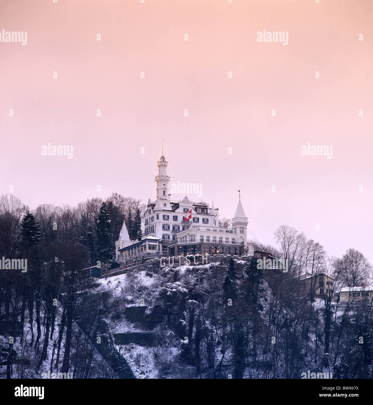 view lighting mountain Grand hotel Gutsch Lucerne snow Switzerland Europe wood forest winter Stock Photo