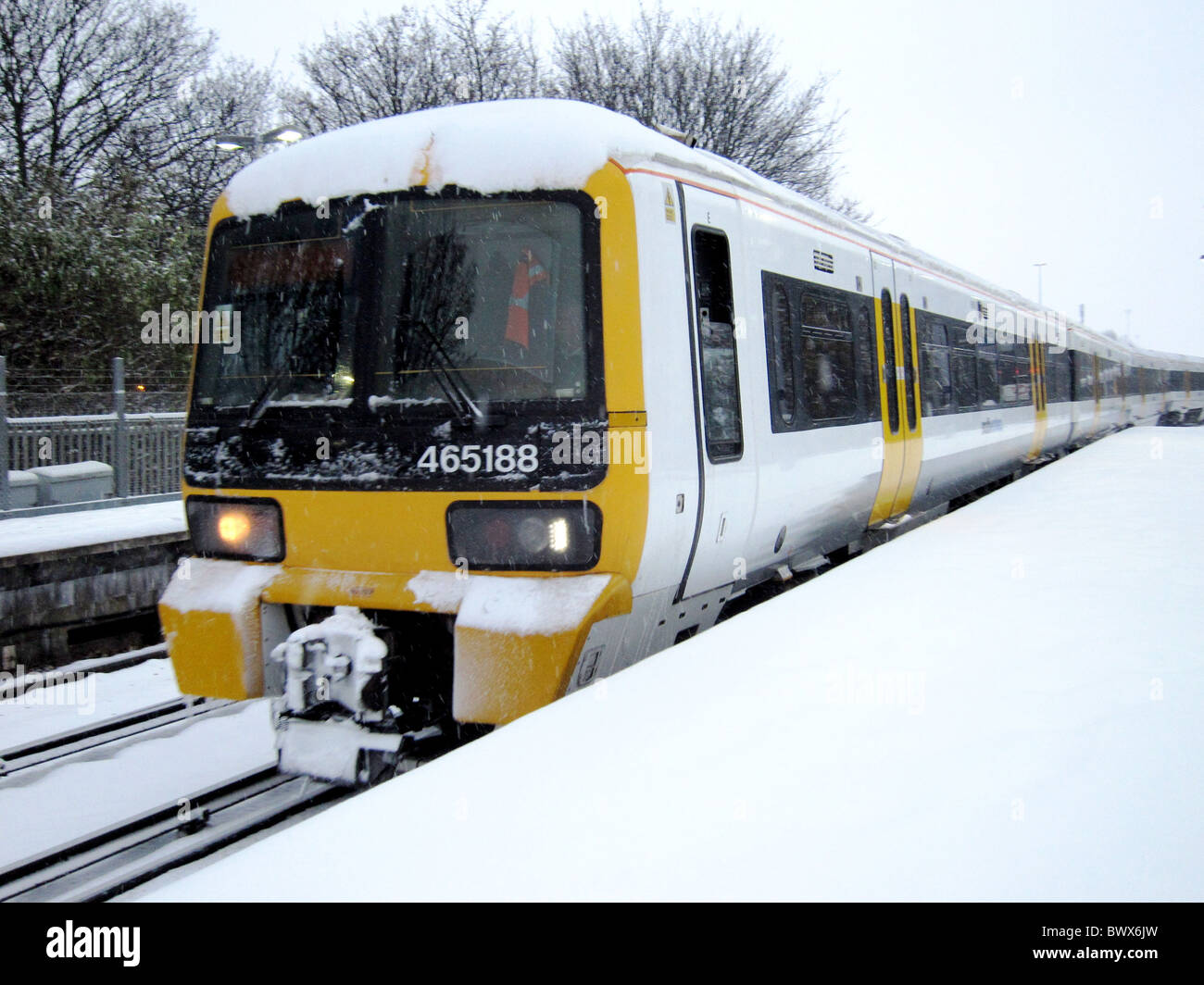 December 2010 - Snow covered train coming in to Hither Green station in South East London Stock Photo