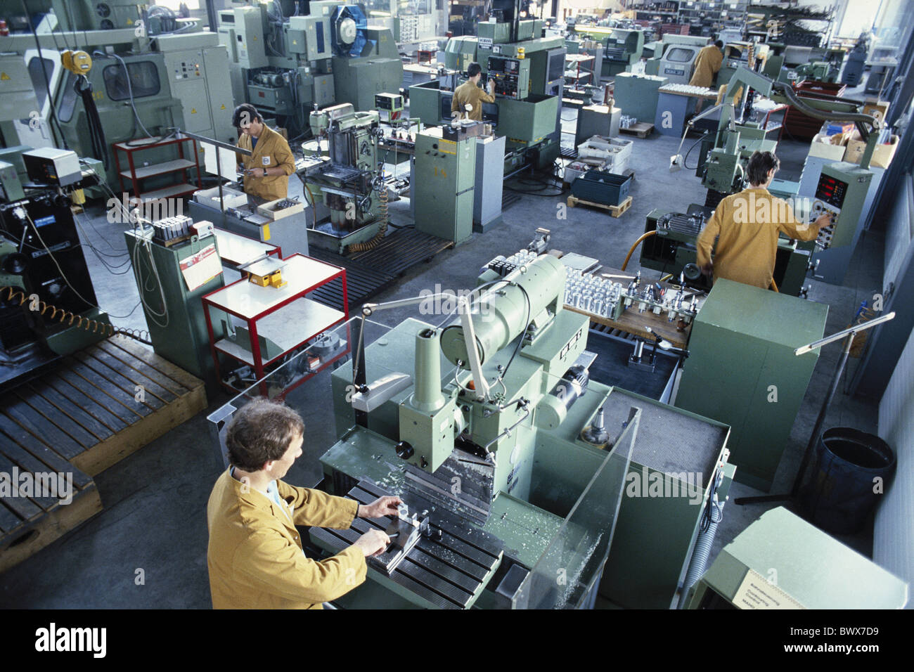 factory factory building shop floor inside tool production production achievement worker industry Stock Photo