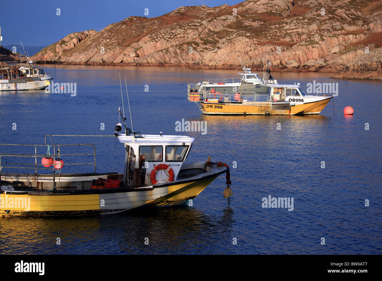 Fishing boats in late afternoon winter sun Stock Photo