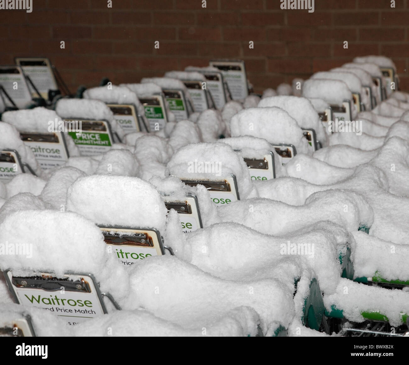 Snow covered waitrose shopping trolleys. Stock Photo