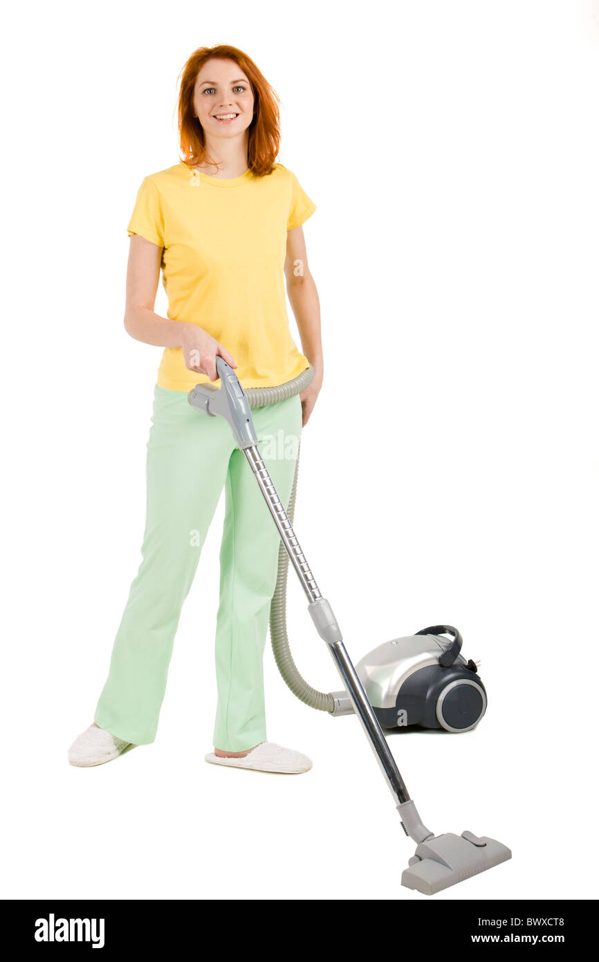 Portrait of nice housewife doing housework with vacuum cleaner Stock Photo