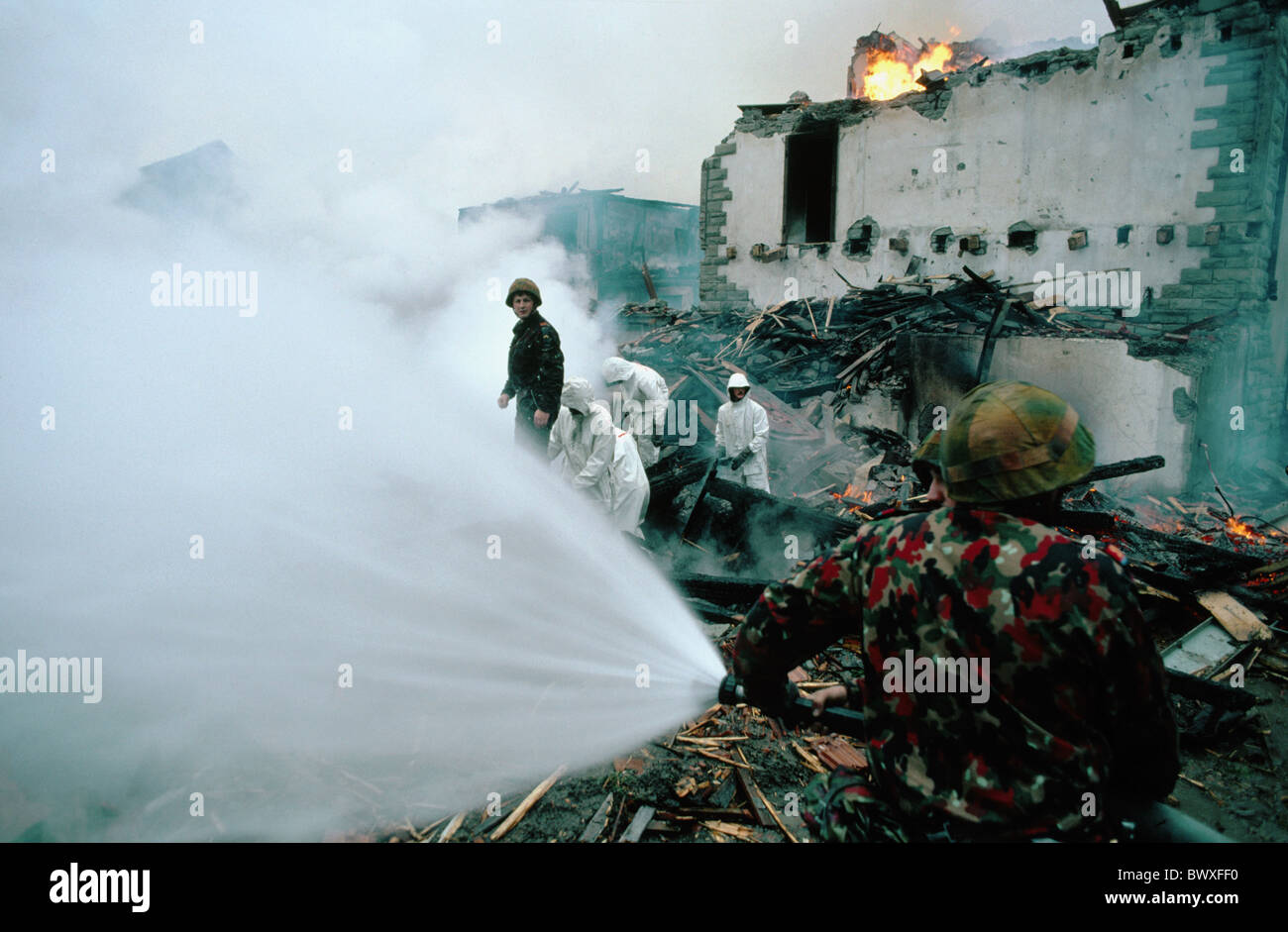 burn house home extinguishing fire brigade department fire-fighting work military Switzerland Europe pract Stock Photo