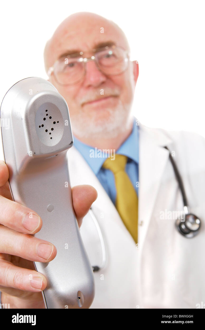 Doctor holding out telephone Stock Photo