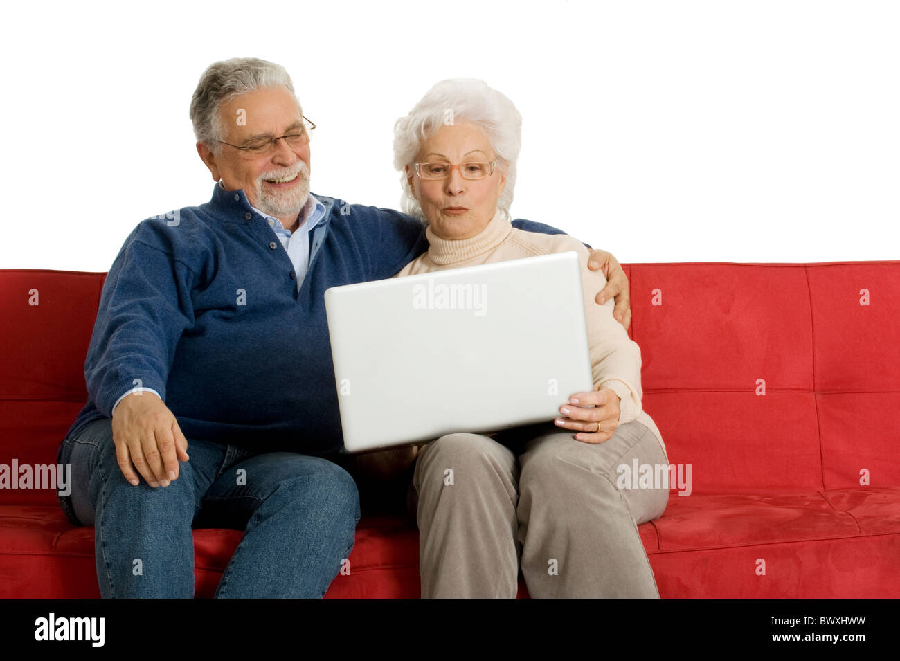 elderly couple on the sofa using a laptop Stock Photo - Alamy