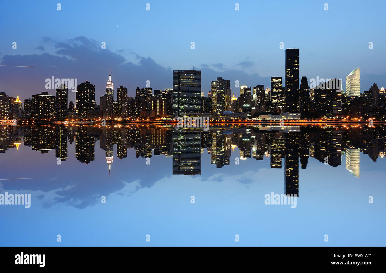 New York City landmark skyline at night with river reflections Stock ...