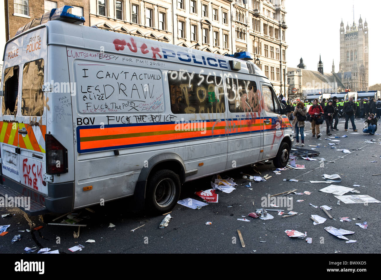 A wrecked and vandalised Metropolitan police vehicle at a demonstration in London. Stock Photo