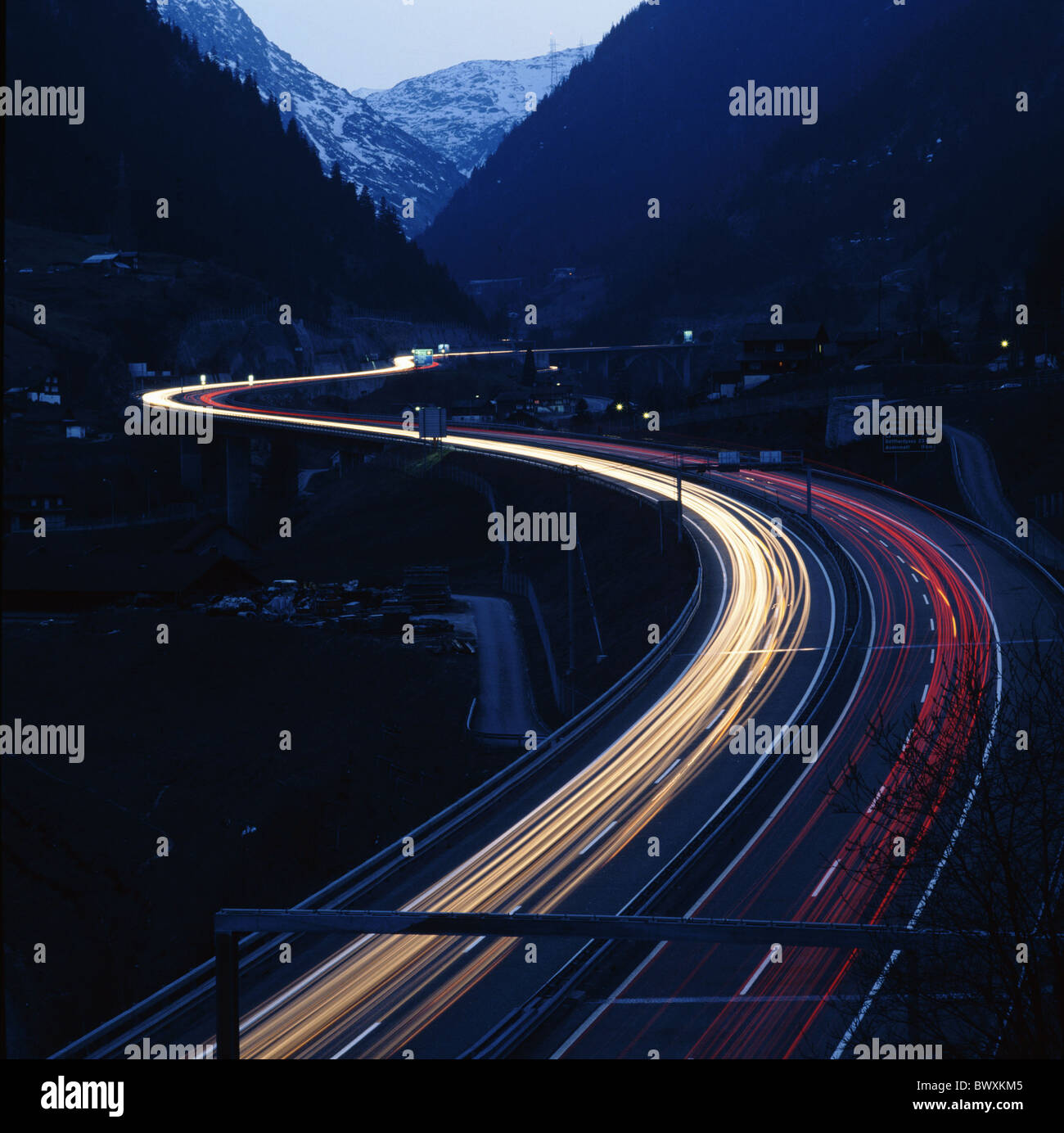 highway dusk twilight light tracks N2 near Wassen at night Switzerland Europe valley panorama Uri Switzerl Stock Photo