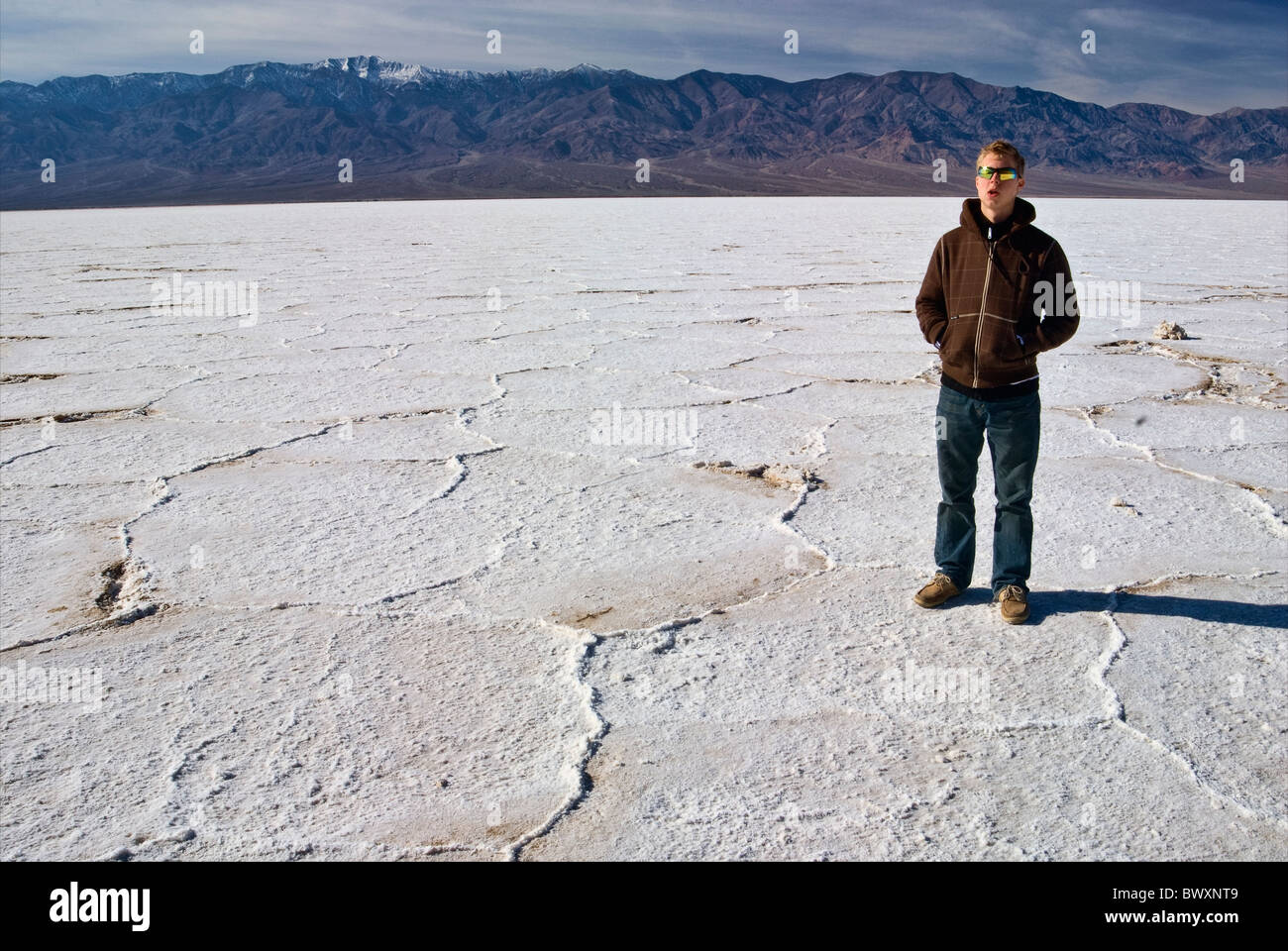 Teenager hiker at Salt Flats in Badwater area, winter, Death Valley, California, USA Stock Photo