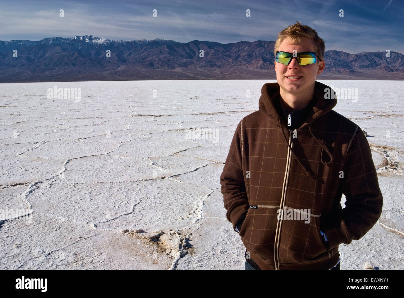 Teenager hiker at Salt Flats in Badwater area, winter, Death Valley, California, USA Stock Photo