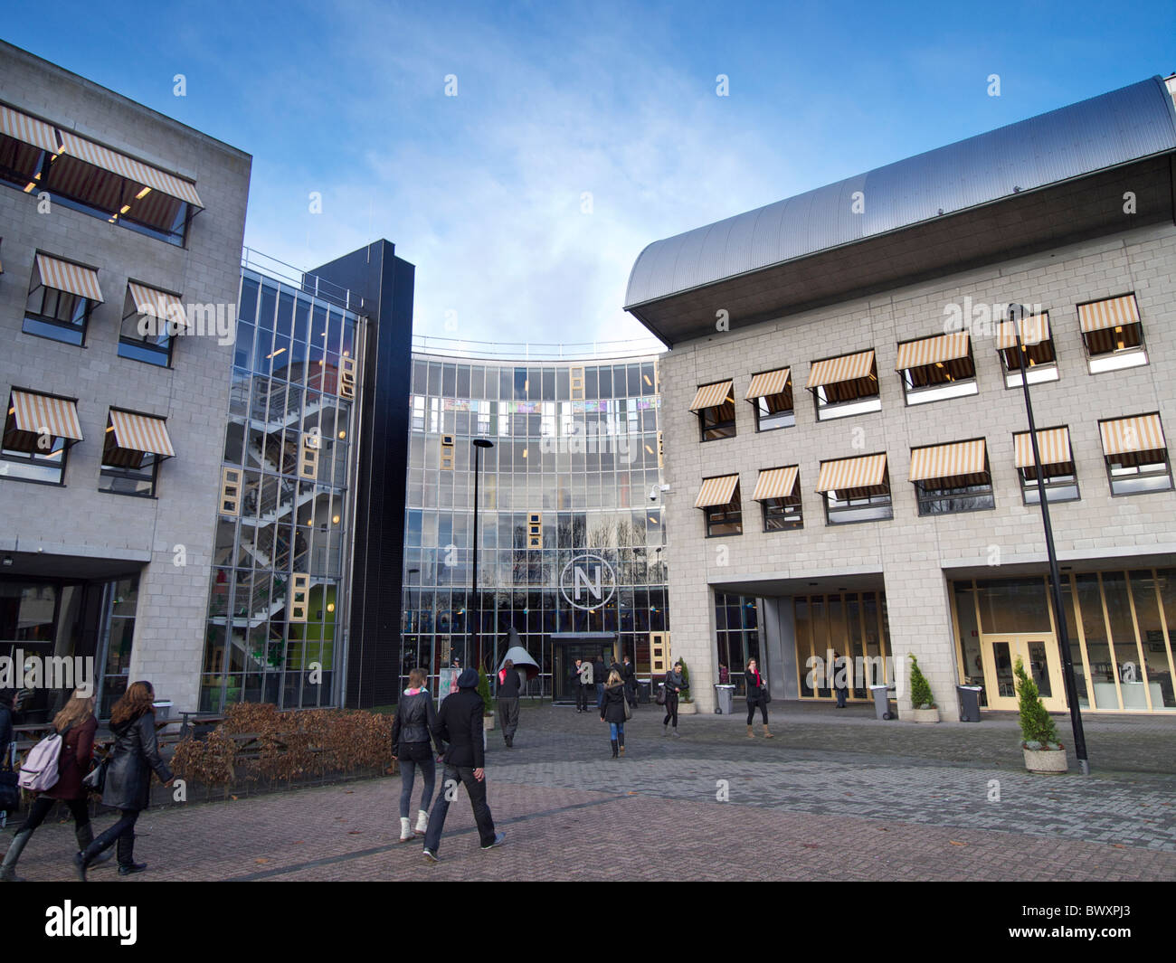 the NHTV building with students in Breda, Noord Brabant the Netherlands. Higher education for the tourism business. Stock Photo