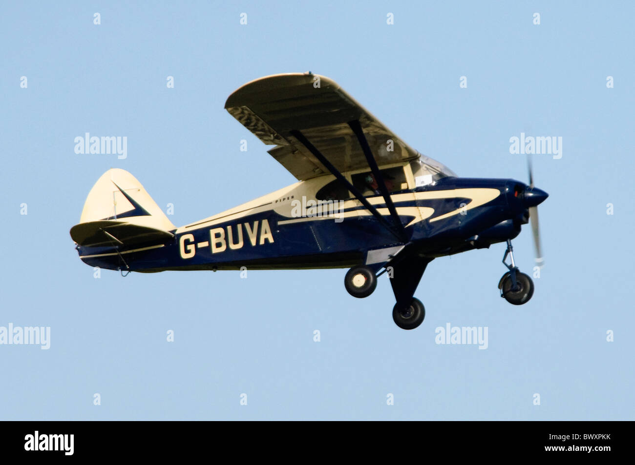 Piper PA-22 Pacer light plane climbing after take off from RAF Benson Stock Photo