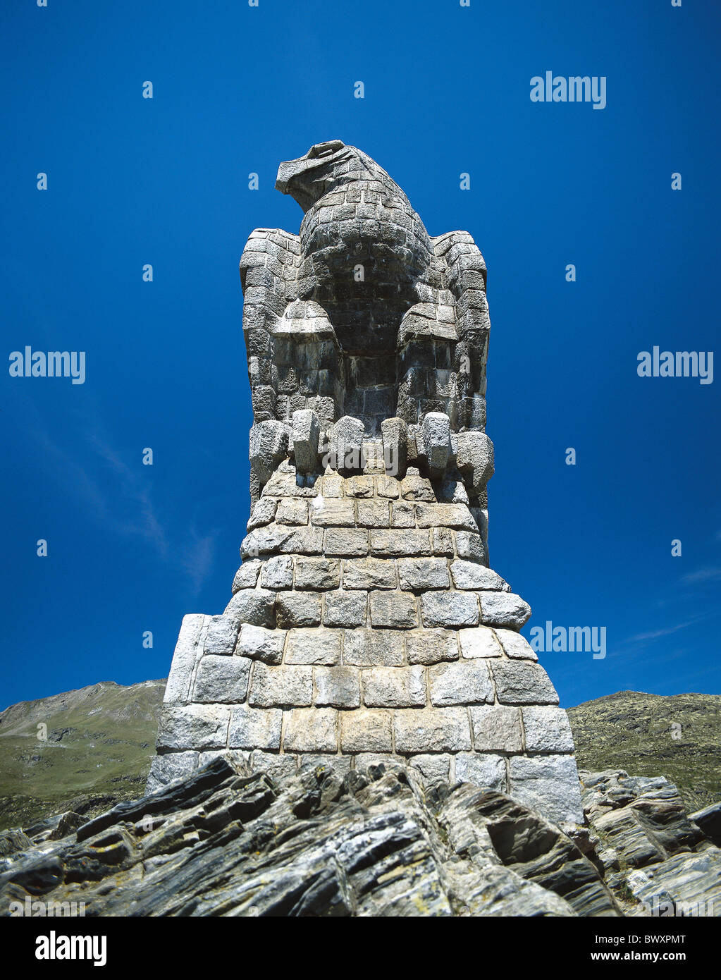plastics sculpture stone figure eagle Switzerland Europe Valais Simplonpass pass height Stock Photo