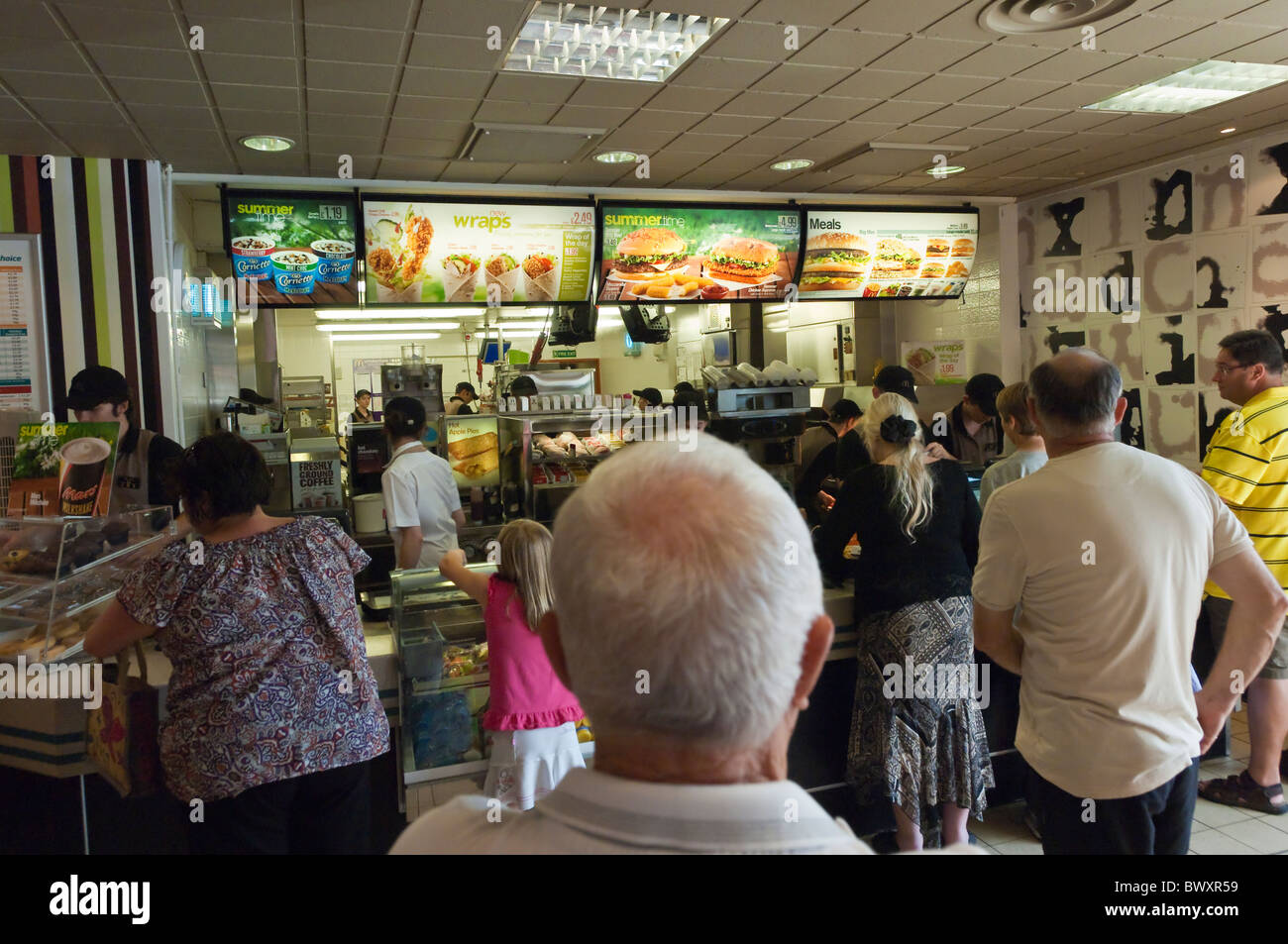People queue for fast food in Mcdonalds restaurant in Wroxham , Norfolk , England , Great Britain , Uk Stock Photo