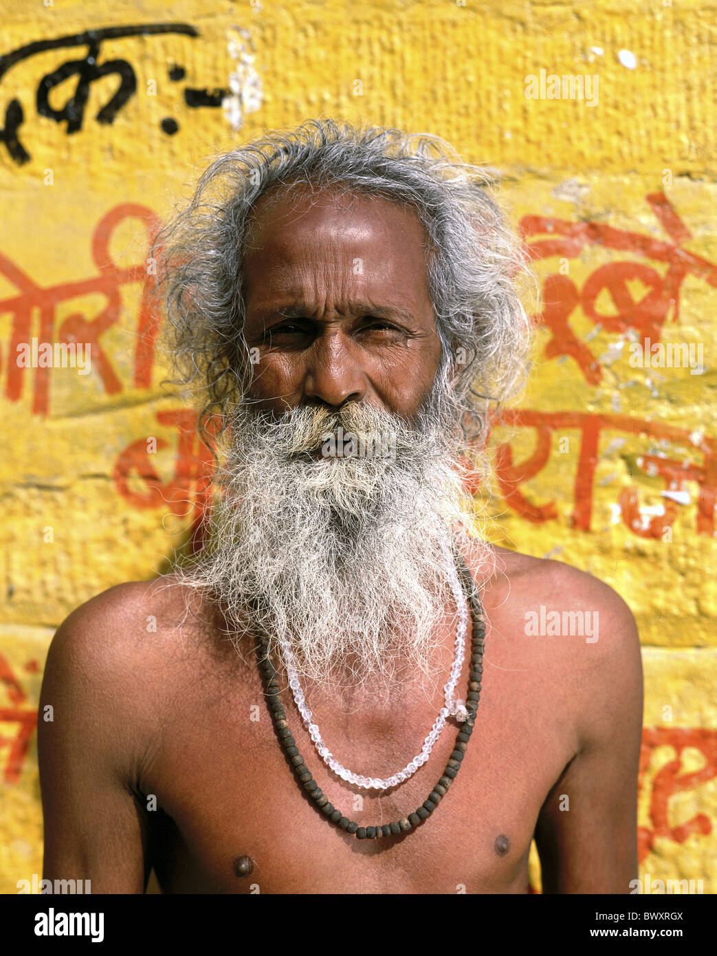 Old beard whiskers necklaces holy man India Asia person portrait white hair Stock Photo