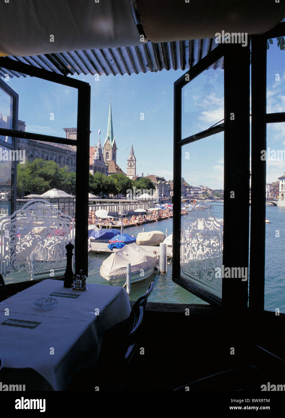 view from Bauschanzli restaurant Frauenbadi baths life Limmat river flow Switzerland Europe town city Stock Photo