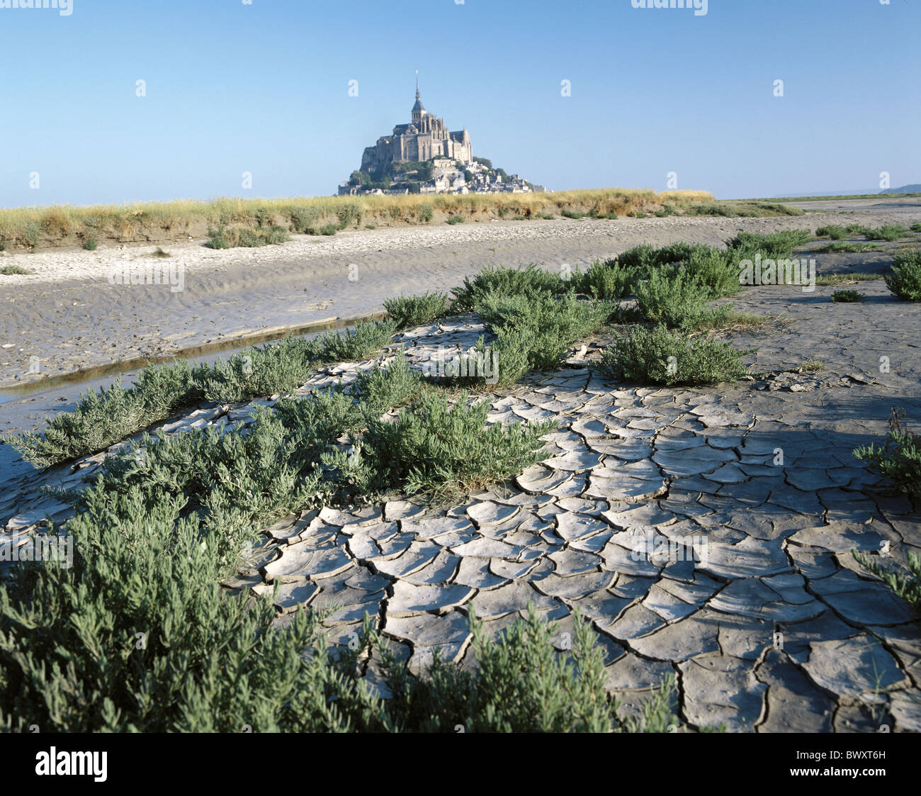 low ebb tide earth cracked France Europe Mont St. Michel Normandy drily Stock Photo